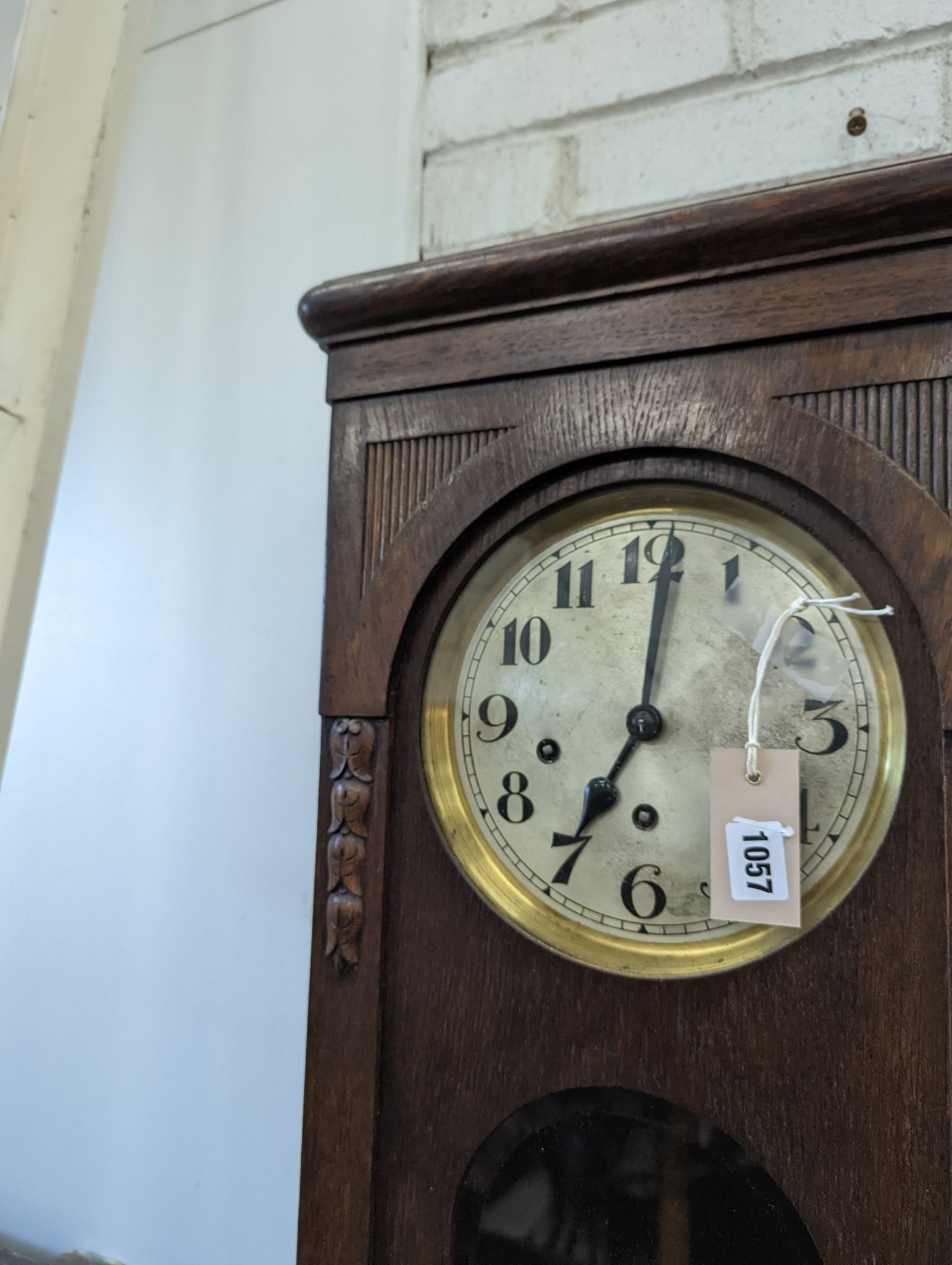 A 1920's oak cased wall clock, height 80cm